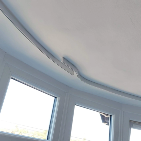 How to Fit a Curtain Track to a Bay Window Ceiling