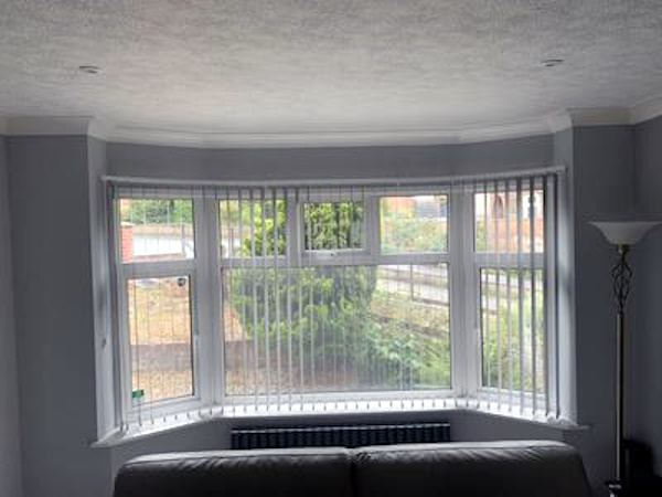 Ceiling mounted bay curtain track in awkward shaped bay - customer photo