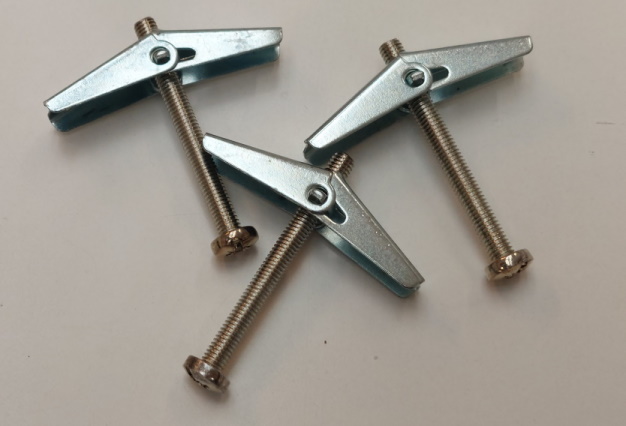 Using Toggle Bolts to Fix a Curtain Track to a Ceiling