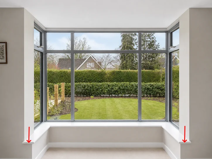 Long curtains need to wrap around ends of deep sill to close gaps