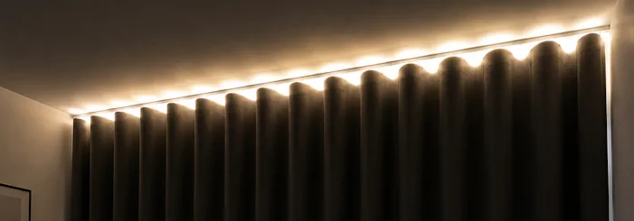 Light gap above blackout lined wave curtains