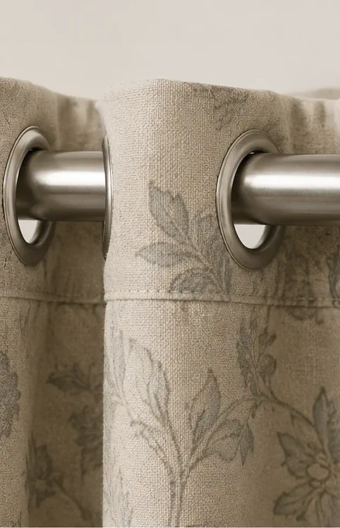 Eyelet curtains shown with a curtain pole rather than a track