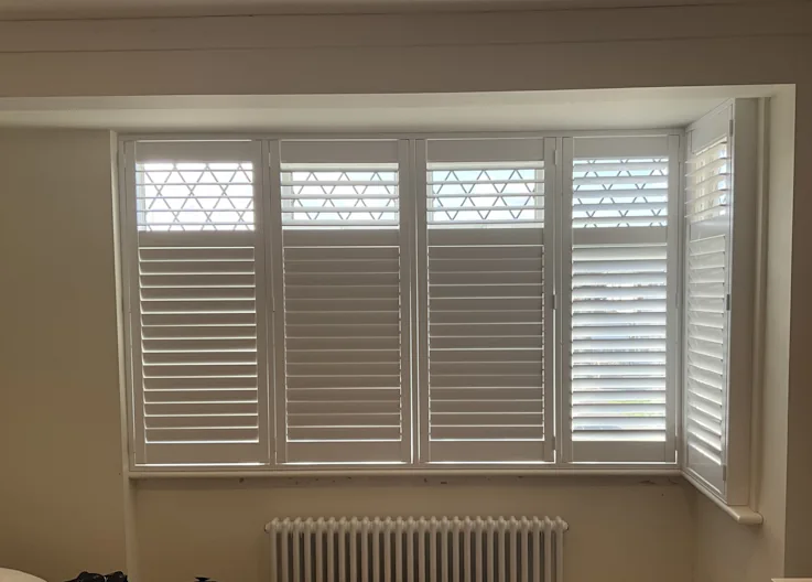 How Do I Hang Curtains in a One-Sided Bay Window?